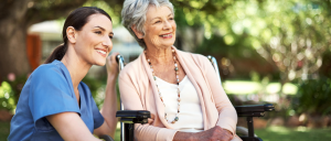 senior patient and caregiver smiling