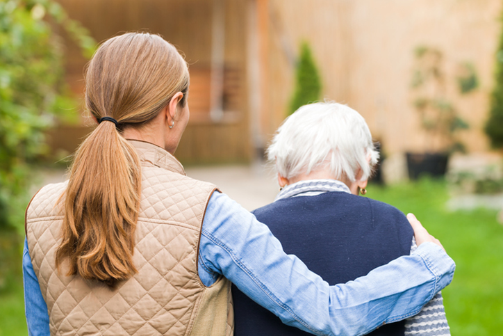 nurse and senior patient walking